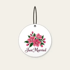 Cherry Blossoms and Just Married Wording Ceramic Ornament in white: A cluster of cherry blossoms in deep rose pink and dark green, with the words “Just Married” in dark plum below.