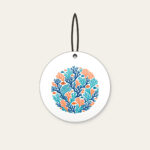 Branching Coral and Tiny Fish on Deep Blue Ceramic Ornament in white: Branching coral and small fish in teal and orange swim across a deep blue background.