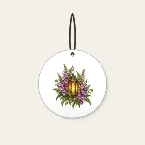 Lantern Among Foxgloves and Ferns Ceramic Ornament in white: A suspended lantern glows amber among violet foxgloves and green fern leaves on a pale stone ground.