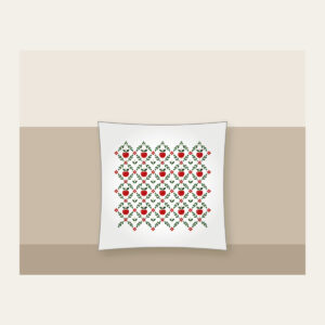 Orchard Diamond Lattice Pillow in white: A diamond lattice with small apple and leaf motifs in red, cream and green.