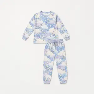 Cloud Garden Raglan Long Sleeve Pajamas with all-over cloud garden of fluffy clouds, small blossoms and stars in pale blue, lilac and cream