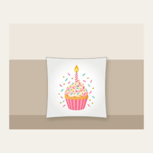 Candlelit Cupcake with Sprinkles Pillow in white: A cupcake with a lit candle and scattered sprinkles in pink, mint and gold.