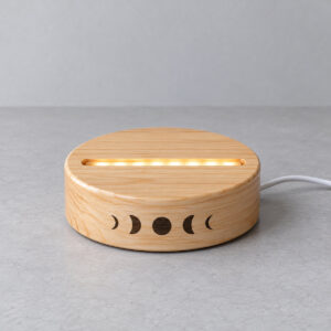 Moon Phase Night Light Base with a round base with a ring of printed moon phases along the front edge, single tone