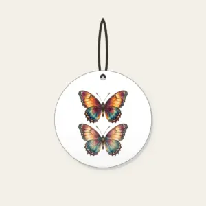 Amber Plum Watercolor Butterfly Ceramic Ornament in white: A butterfly with watercolor-style wings in amber, plum and teal, traced with delicate vein linework.