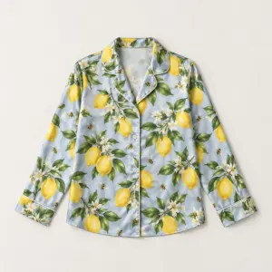 Lemon Grove Satin Pajama Shirt with all-over repeat of lemons, glossy leaves and tiny bees in yellow and green on a pale blue-grey ground