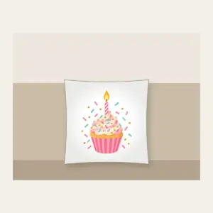 Candlelit Cupcake with Sprinkles Pillow in white: A cupcake with a lit candle and scattered sprinkles in pink, mint and gold.