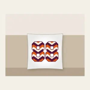 Plum Chevron Panels with Number 88 Pillow in white: Bold chevron panels in plum, burnt orange and cream, with the number “88” standing out in the middle.