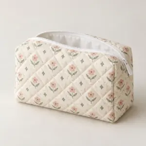 Bloom Quilt Makeup Pouch with a flat printed bloom pattern of small flowers and diamonds in blush, sage and cream
