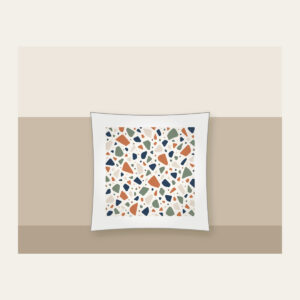 Chip Terrazzo in Terracotta and Navy Pillow in white: An all-over terrazzo of chips in terracotta, sage, navy and cream on a warm white field.