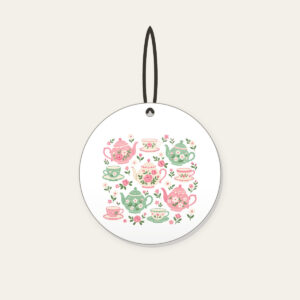 Teapots and Tiny Flowers Ceramic Ornament in white: Cheerful teapots and little flowers in pink and mint scatter across a cream ground.