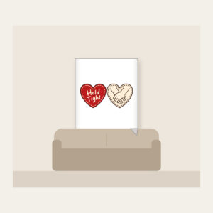 Hold Tight Heart and Hands Fleece Blanket in white: A red dashed heart marked “Hold Tight” on one side and two clasped cream hands in brown on the other.
