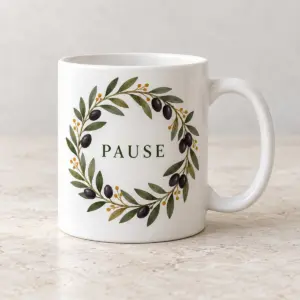 Olive Grove Ceramic Mug with flat printed olive branch wreath with dark olive fruits, restrained olive green leaves and small ochre dots, exact central text PAUSE in simple deep green serif letters