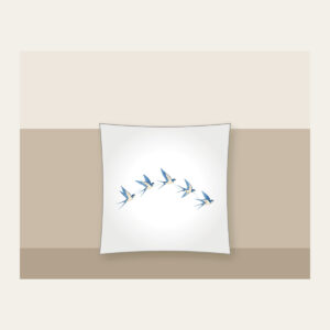 Five Swallows in a Gentle Arc Pillow in white: Five swallows in cream and sky blue fly in an arc along a fine dotted trail.