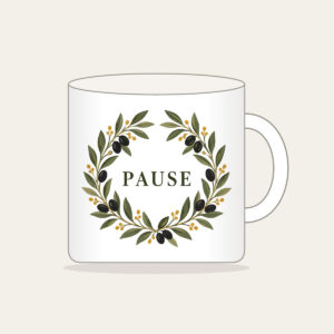 Olive Branch Wreath with PAUSE Mug in white: An olive branch wreath with dark fruits and ochre dots circles the word PAUSE in simple deep green serif letters.