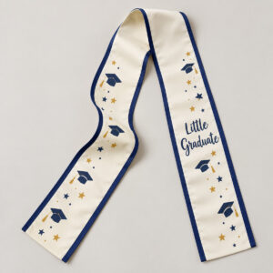 Little Graduate Stole with a cream stole with small printed mortarboard caps and stars along both ends in navy and gold, a printed navy border band and the exact text "Little Graduate"