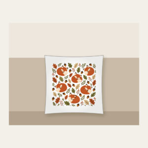 Curled Foxes, Acorns and Leaves Pillow in white: Curled-up foxes, acorns and leaves repeat in rust, cream and moss.