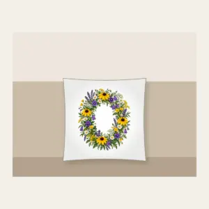 Oval Wildflower Wreath Pillow in white: A bold oval wildflower wreath in yellow, purple and green sits at the centre.