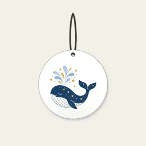 Starry Whale with Water Spout Ceramic Ornament in white: A friendly whale lifts a spout of water among tiny white and gold stars.