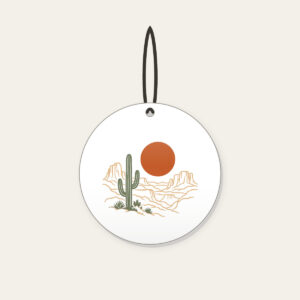 Desert Sun and Canyon Lines Ceramic Ornament in white: A rust-orange sun disc over sparse canyon contour lines and one sage cactus silhouette, flat screen look.