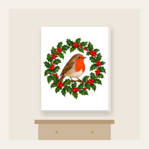 Robin in a Holly Wreath Canvas Print in white: A robin perches in a holly wreath in red, brown and green.
