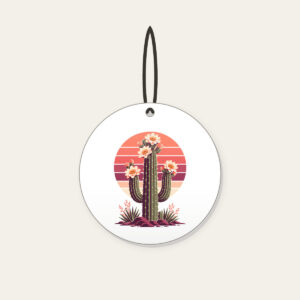 Flowering Saguaro and Striped Sun Ceramic Ornament in white: A flowering saguaro cactus stands against a striped sunset sun in coral, plum and cream.