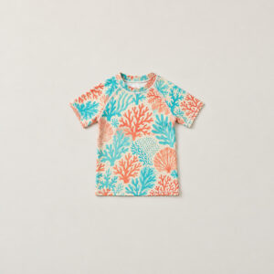 Youth Coral Reef Short-Sleeve Rash Guard with all-over coral reef shapes in coral, aqua and cream