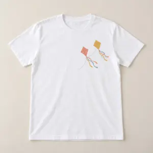 Paper Kite Line Classic Tee with compact front chest panel print of two paper kites with ribbon tails on a thin line in coral, mustard and sky blue