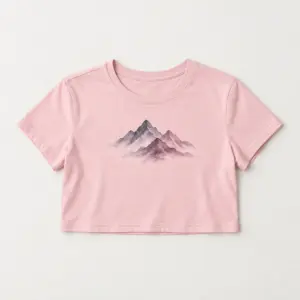 Ink Wash Peaks Cropped Tee with small chest print of three overlapping ink-wash mountain peaks in charcoal grey and faded plum