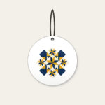Mustard and Navy Patchwork of Stars Ceramic Ornament in white: A patchwork of stars and diamonds in navy, mustard and cream.