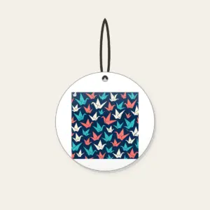 Origami Cranes on Navy Ceramic Ornament in white: Folded paper cranes in coral, teal and cream scatter across a navy ground.
