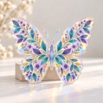 Butterfly Garden Hologram Plaque with butterfly-shaped plaque with symmetrical wings of tiny leaves and blossoms in violet, teal and gold, 2-side printed