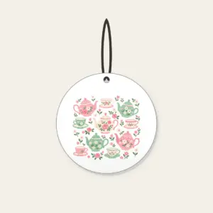 Teapots and Tiny Flowers Ceramic Ornament in white: Cheerful teapots and little flowers in pink and mint scatter across a cream ground.