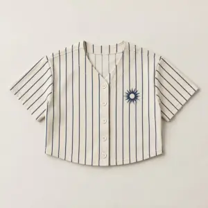 Court Stripe Crop Baseball Jersey with crop jersey with narrow tonal stripes in navy and cream, a small sunburst crest on the chest, no piping