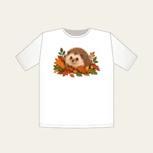 Hedgehog Among Fallen Leaves T-Shirt in white: A small hedgehog wanders among fallen leaves in brown, rust and green.