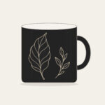 Single-Line Leaf Drawing Mug in black: One unbroken cream line sketches a graceful leaf, answered by a small sprig on the reverse side.