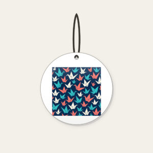 Origami Cranes on Navy Ceramic Ornament in white: Folded paper cranes in coral, teal and cream scatter across a navy ground.