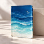 Wave Study Acrylic Plaque with plaque face with layered wave lines in a deep blue to pale aqua gradient and one small gull, Rectangle type
