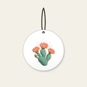 Prickly Pear with Three Coral Blossoms Ceramic Ornament in white: A prickly pear cactus with three coral blossoms and fine sun rays in weathered turquoise and coral.