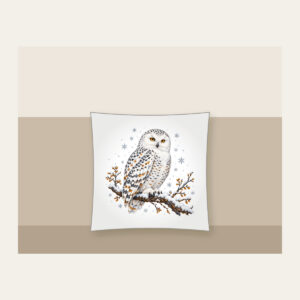Snowy Owl in Snowfall Pillow in white: A snowy owl on a branch in white, slate and amber with falling snowflakes.