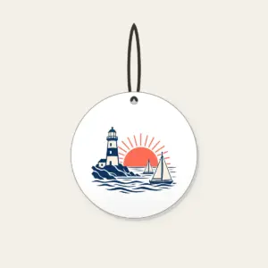 Lighthouse and Two Sailboats Ceramic Ornament in white: A navy lighthouse, two cream sailboats outlined in navy and a coral rising sun.