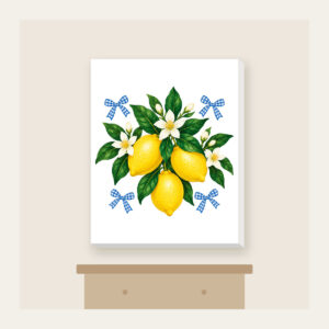 Lemons with Gingham Corners Canvas Print in white: Bright yellow lemons and deep green leaves on a clean white ground, tucked with small blue gingham accents.