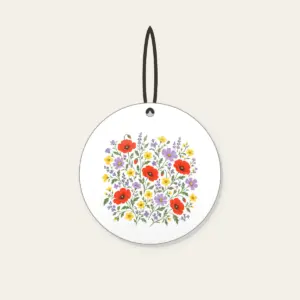 Wildflower Scatter on Sage Ceramic Ornament in white: Wildflowers in lavender, poppy red and butter yellow scatter over a sage ground.