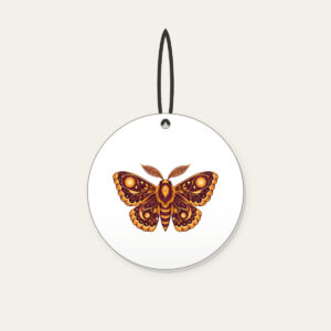 Glowing Amber Moth Ceramic Ornament in white: A large moth with intricately patterned wings, each marked with a glowing circle in amber and plum.