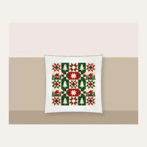 Cabin, Tree and Star Patchwork Pillow in white: Patchwork squares hold simple cabin, tree and star motifs in red, cream and green.