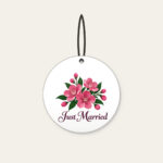 Cherry Blossoms and Just Married Wording Ceramic Ornament in white: A cluster of cherry blossoms in deep rose pink and dark green, with the words “Just Married” in dark plum below.