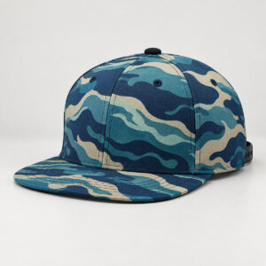 Tide Camo Snapback Cap with a camouflage of tide-line shapes in navy, teal and sand across the crown and brim