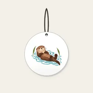 Floating Otter on Teal Ripples Ceramic Ornament in white: A cocoa-brown otter floats on its back in teal ripple lines beside two reed leaves.