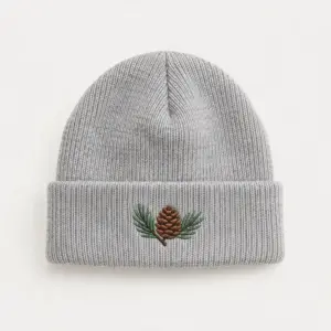 Light Grey Pine Cone Cuffed Beanie with embroidery of a pine cone with two needles in brown and green on the cuff of a Light Grey beanie