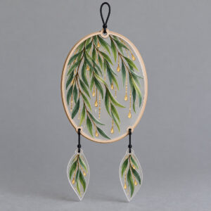 Dewdrop Willow Suncatcher with weeping willow branches in green and gold with tiny dewdrops printed on the main piece, pendants drawn as small leaves