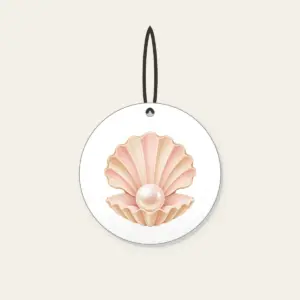 Scallop Shell Holding a Pearl Ceramic Ornament in white: A scallop shell holds a single pearl in blush and sand tones.